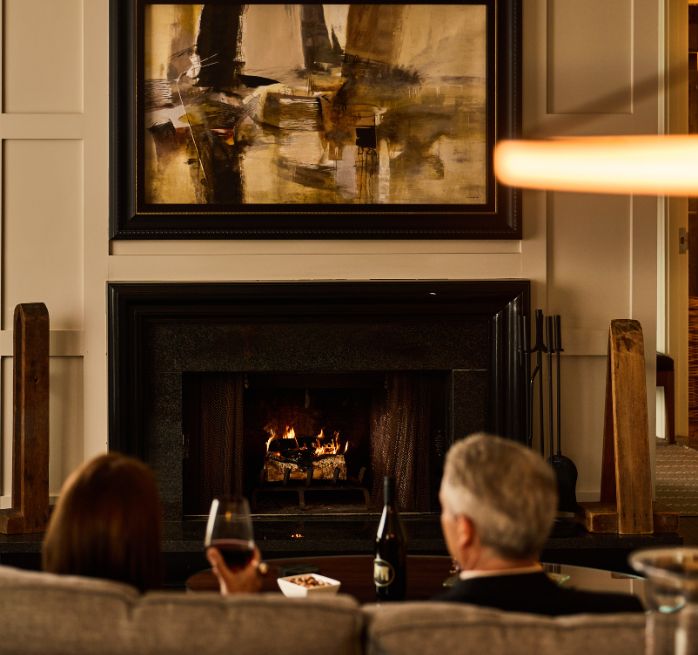 Couple in a room by the fire