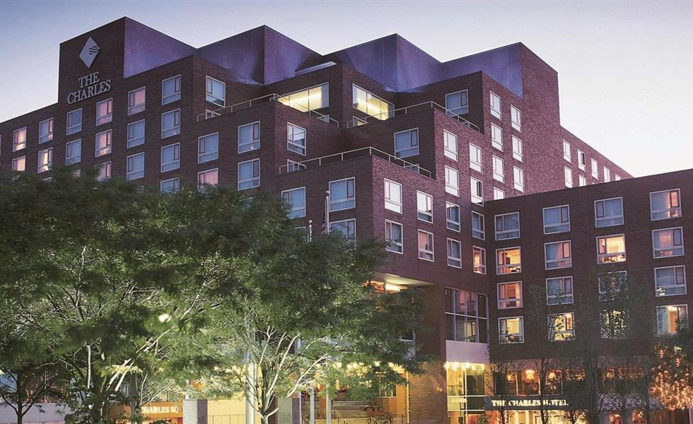 Exterior of The Charles Hotel at dusk