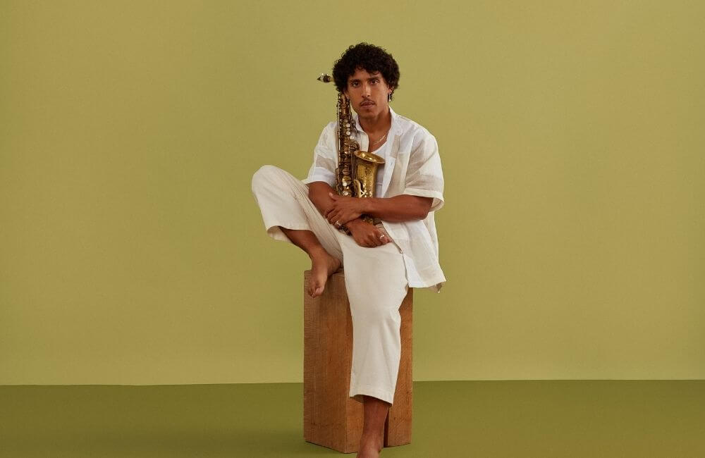 Jonathan Suazo sitting on a stool