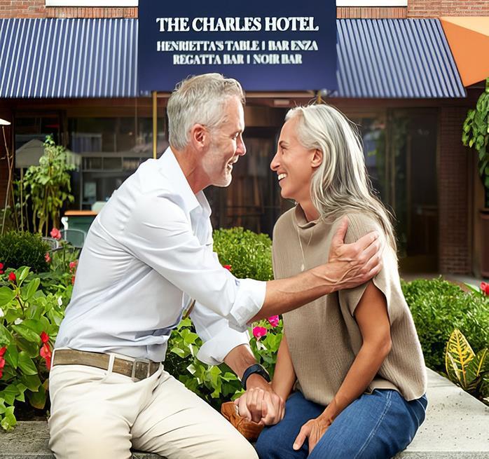 Two older people smiling at one another