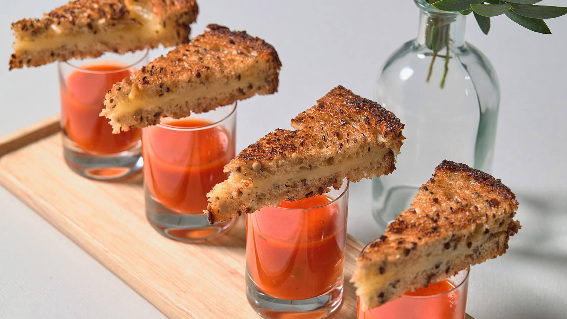 Mini grilled cheese with shots of tomato soup