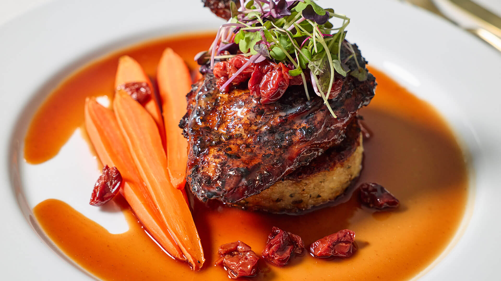 Seared meat with thinly sliced carrots