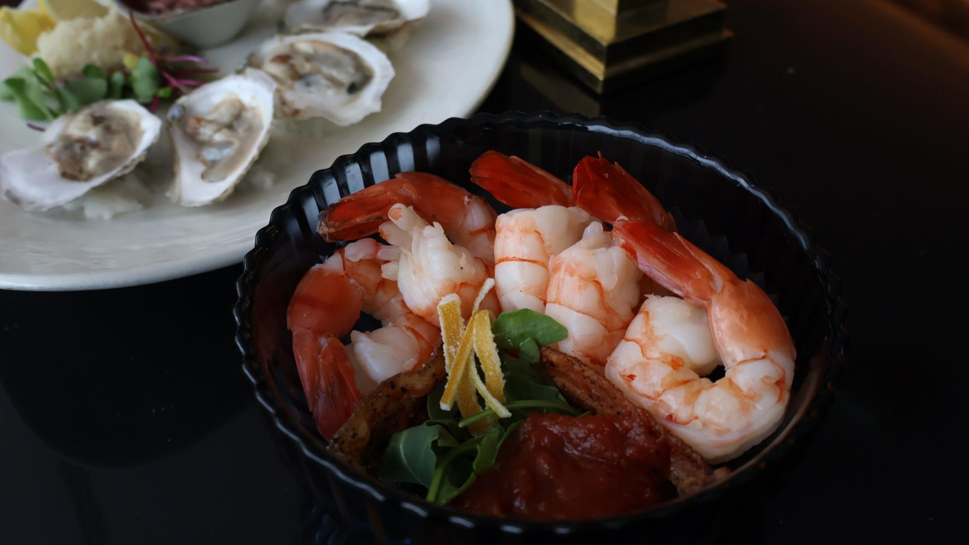 Shrimp with oysters on half shell in back