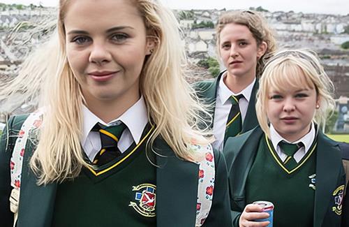 Three school girls dressed up for the themed festival