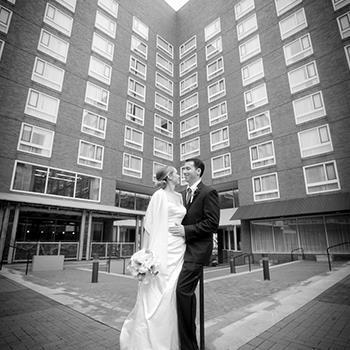 Married couple in front of the Charles Hotel 