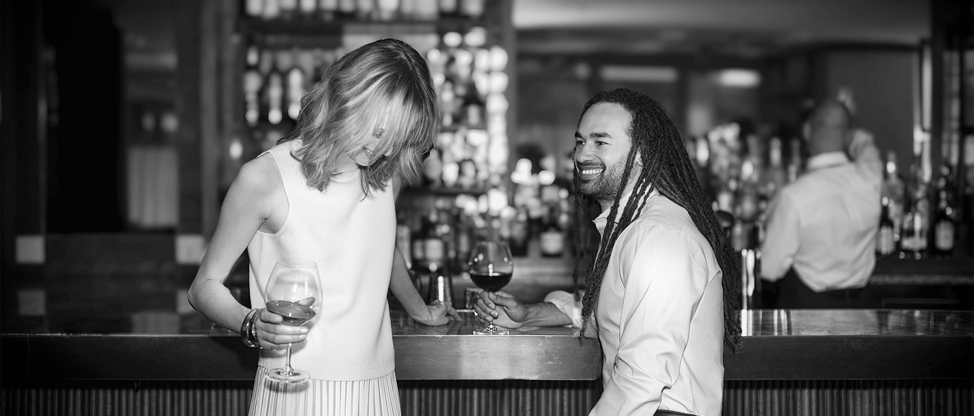 A couple enjoying drinks at the bar