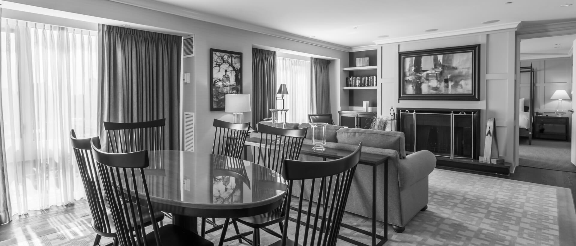 black and white image of a suite living room area