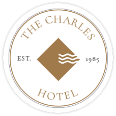 The Charles Hotel Established 1985 Circle Badge with a square and squiggly lines